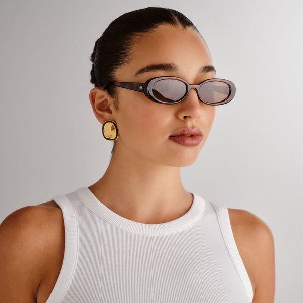 Tortoiseshell Oval Sunglasses with Statement Earrings — Sunglasses for Heart Shaped Face