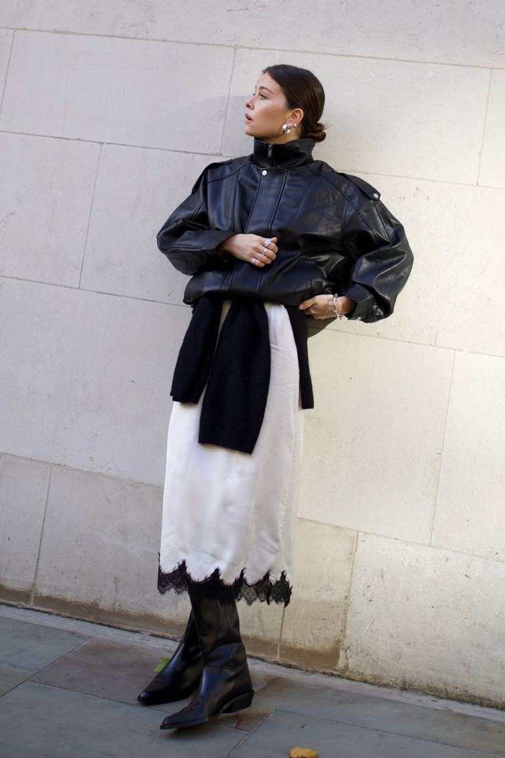 Chic Layering: Black Cowboy Boots with Lace Slip Skirt and Leather Jacket — Cowboy Boots with Skirt Outfits