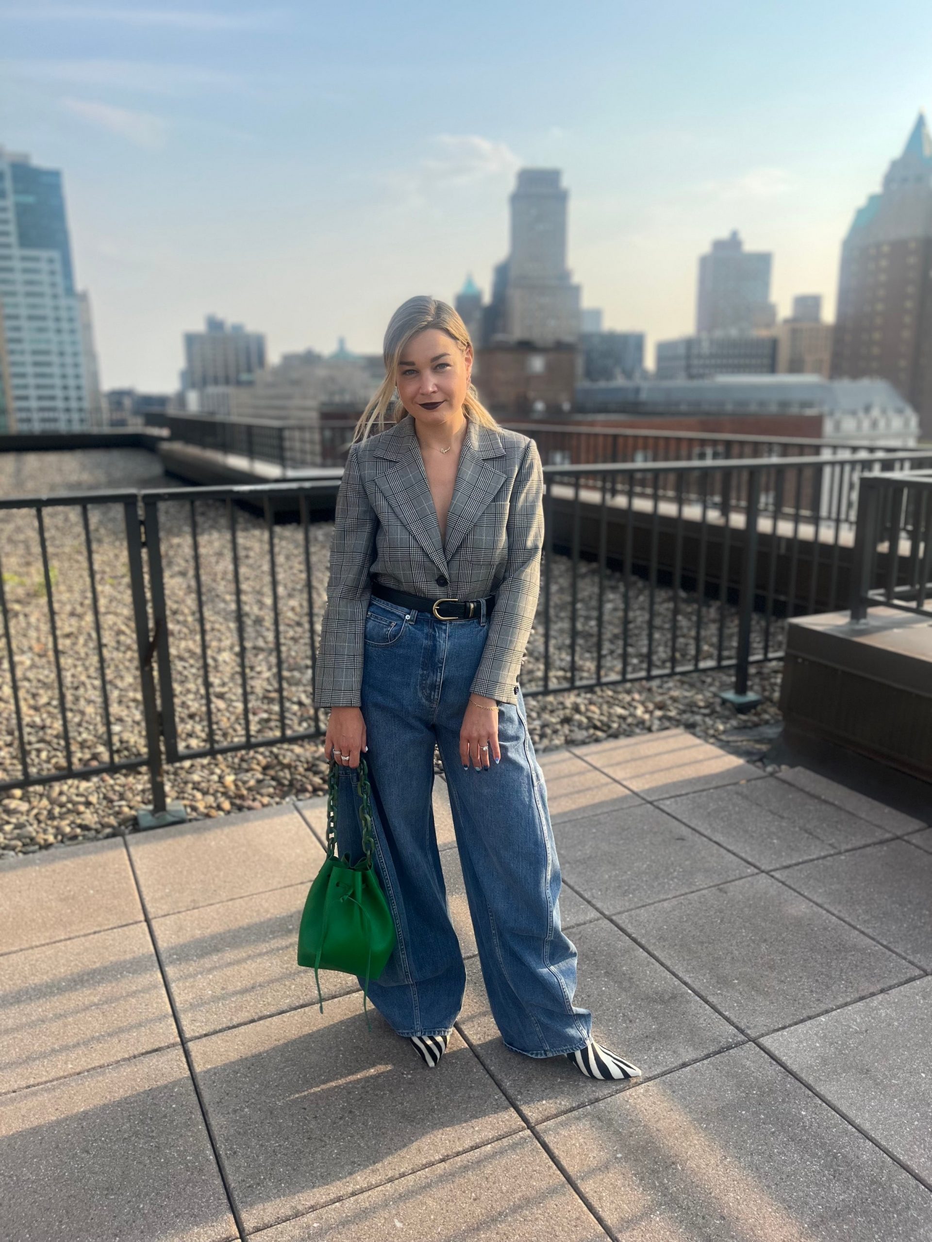 Light Blue Wide Leg Jeans with a Checked Blazer and Striped Boots