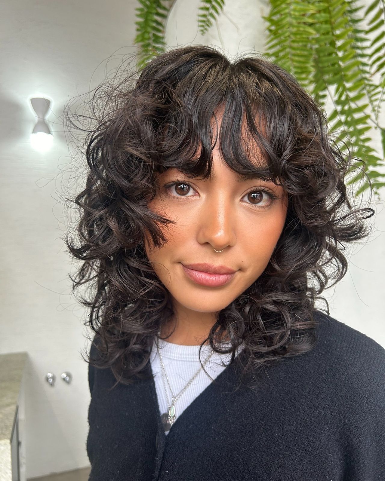 Front View Close Crop Defined Collarbone Shag With Curtain Bangs — Curly Shag