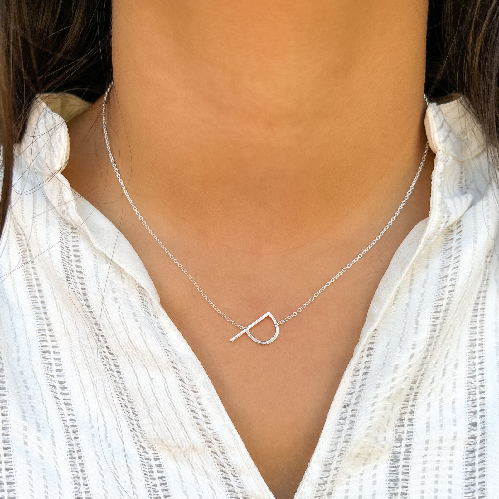 Silver Initial 'P' Necklace on White Textured Shirt Silver Initial 'P' Necklace on White Textured Shirt — Initial Necklaces