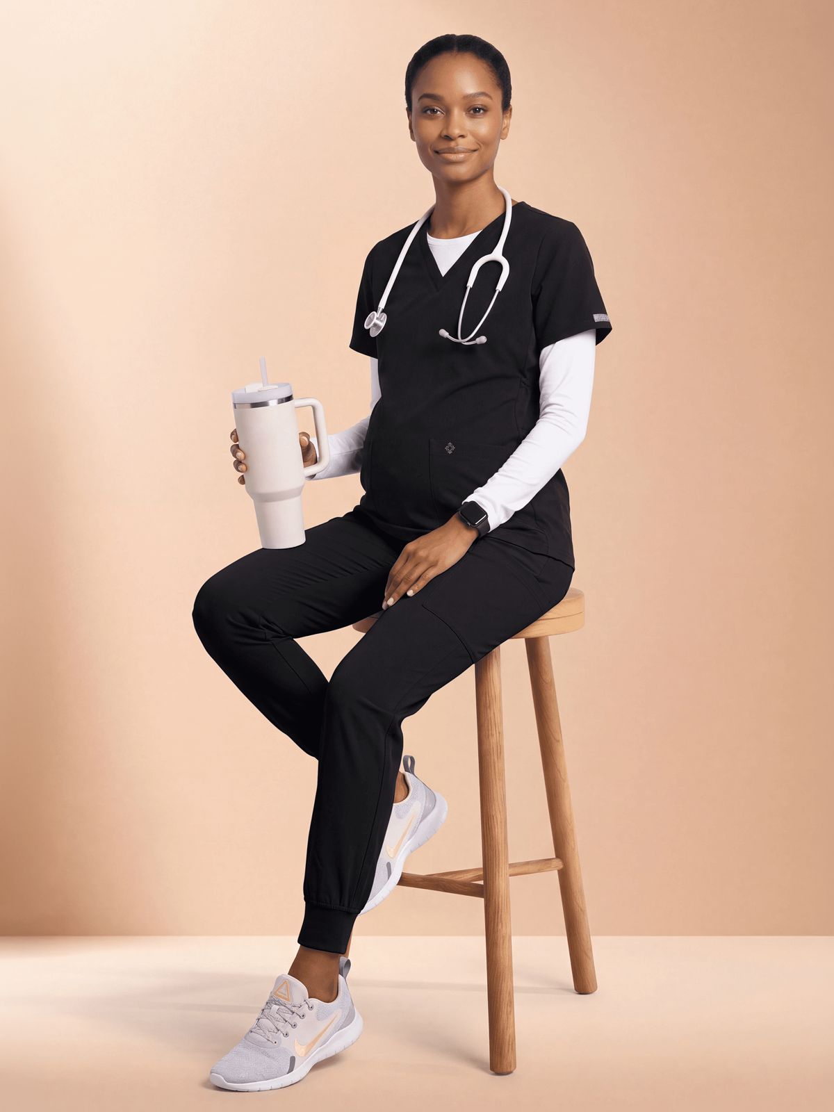 Black Scrubs with Grey Sneakers and Stethoscope Black Scrubs with Grey Sneakers and Stethoscope — Scrubs Outfits