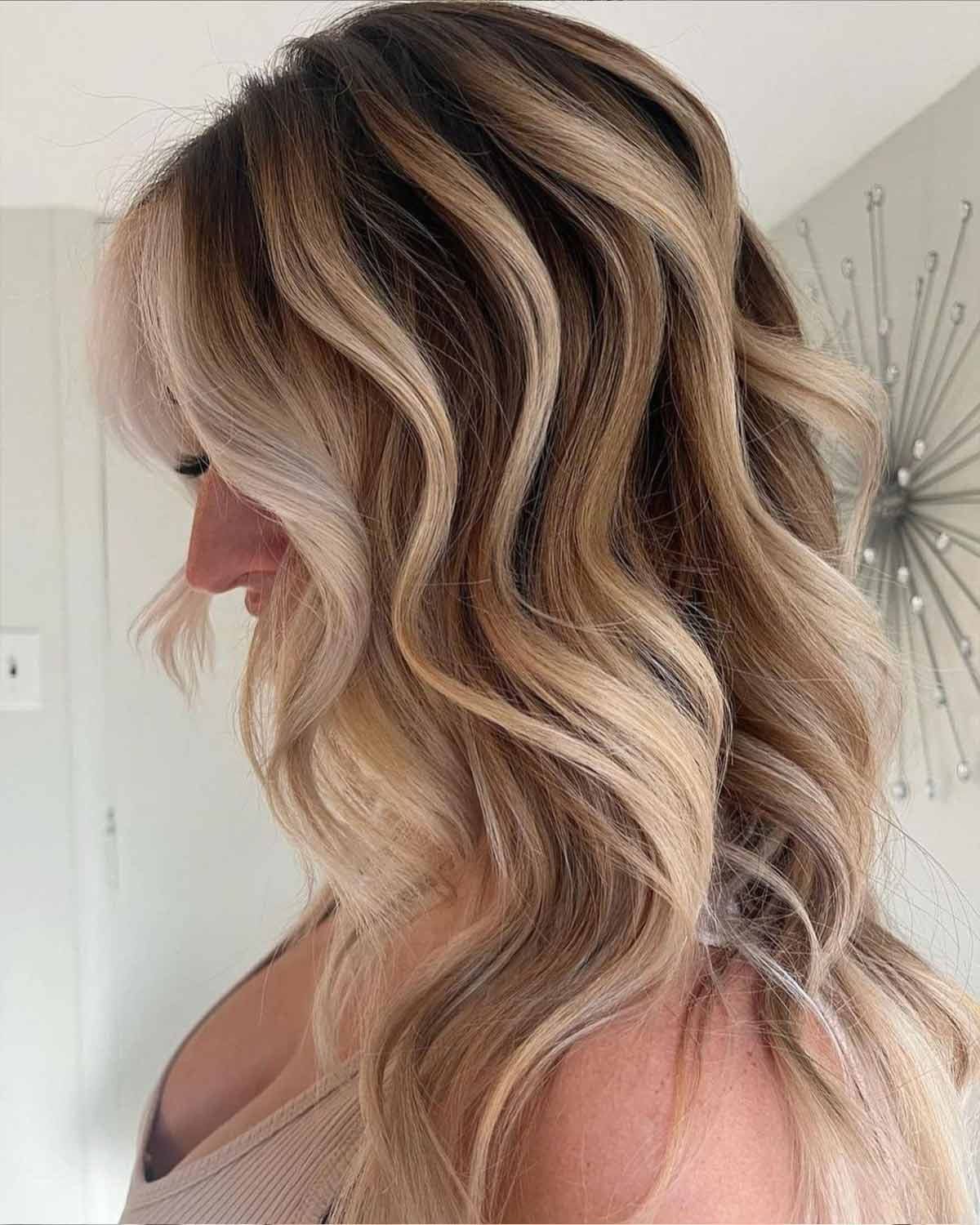Collarbone Voluminous Blonde Highlights On Dark Blonde