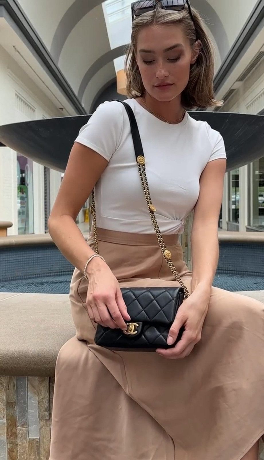 Casual Shopping: White Tee, Beige Skirt, and Coin Detail Chanel Bag Casual Shopping: White Tee, Beige Skirt, and Coin Detail Chanel Bag — Chanel Bag Outfits
