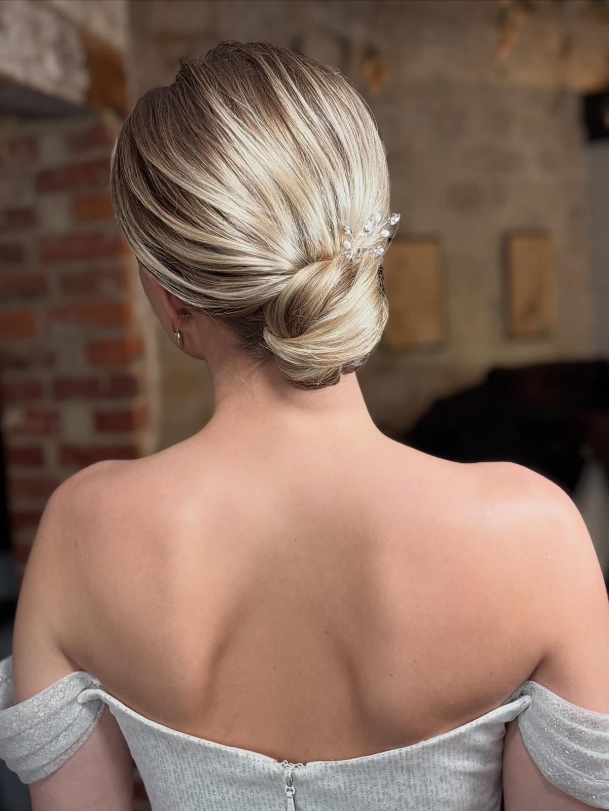 Polished Blonde Low Bun with Accessory — Wedding Low Bun