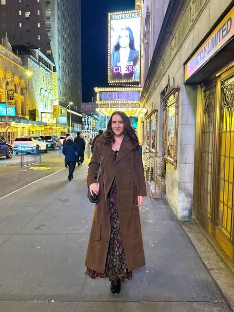 Long Brown Coat Over a Floral Print Dress Long Brown Coat Over a Floral Print Dress — Broadway Outfits