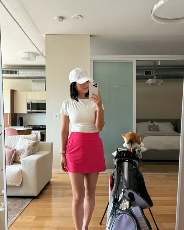Sporty White T-Shirt and Bright Pink Skort — Golf Tournament Outfits