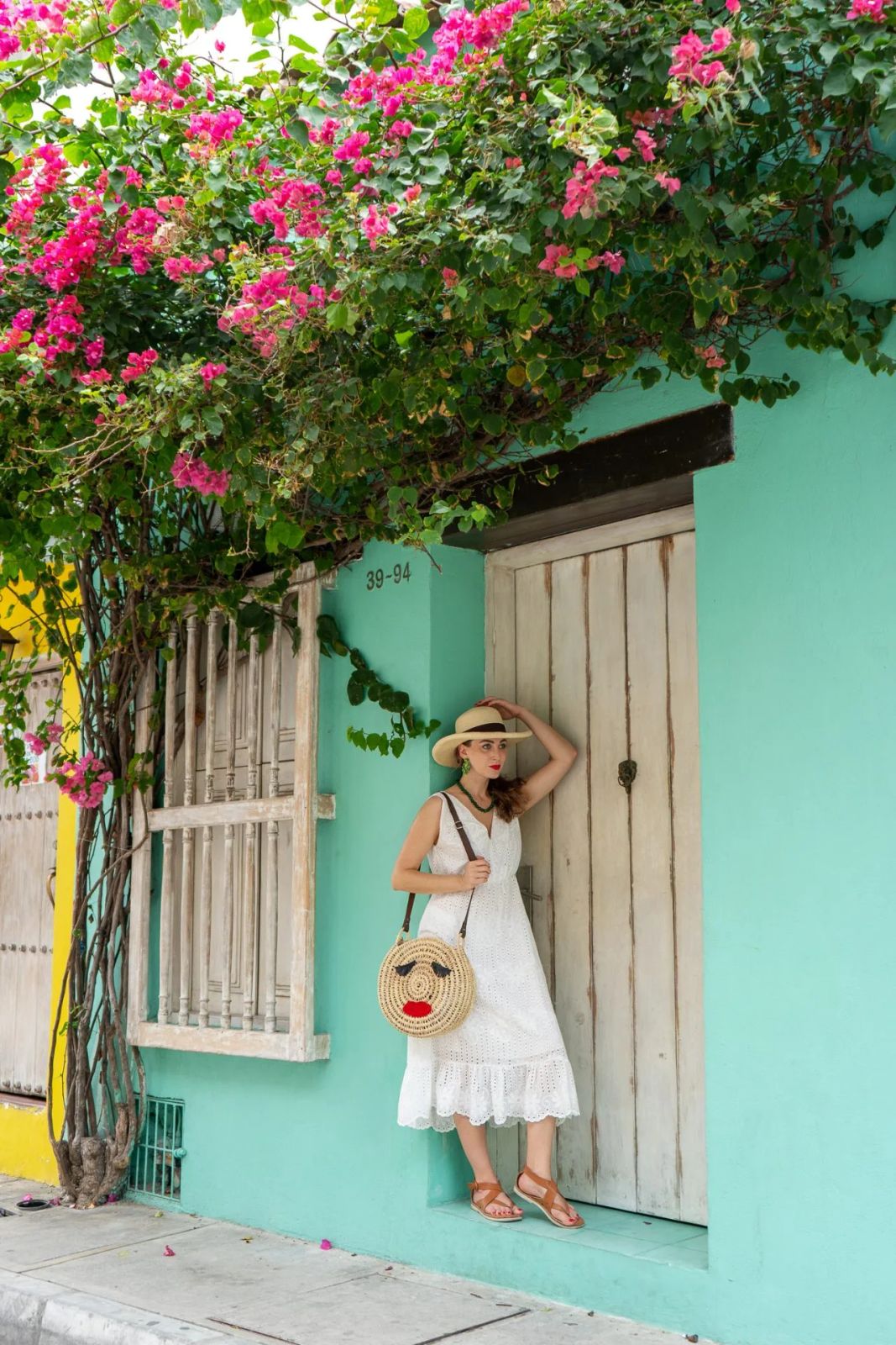 Lace Trim Elegance: White Midi Dress with Unique Straw Bag — Cartagena Outfits