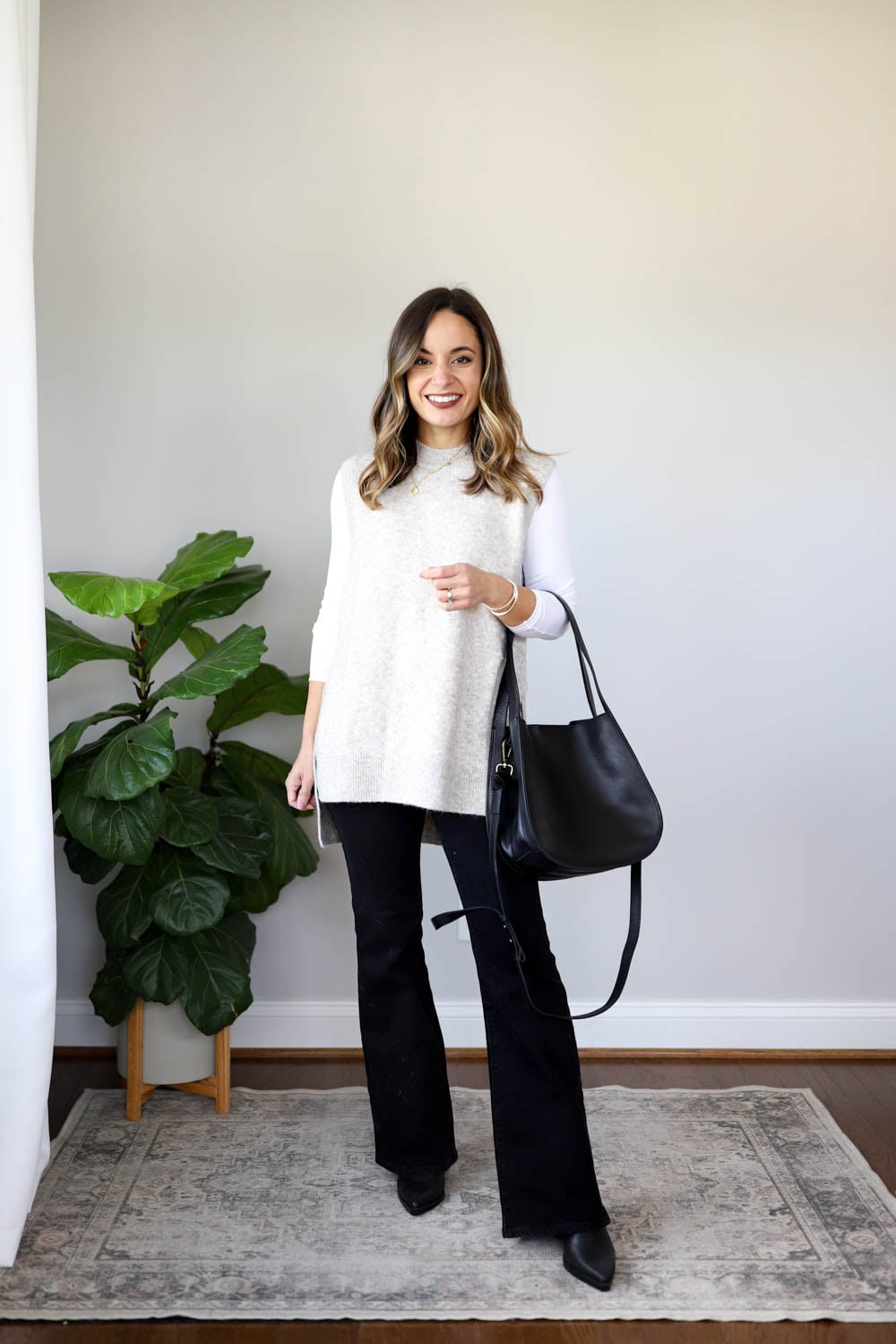 Oversized Knit Vest Over Black Flares — Flare Jeans