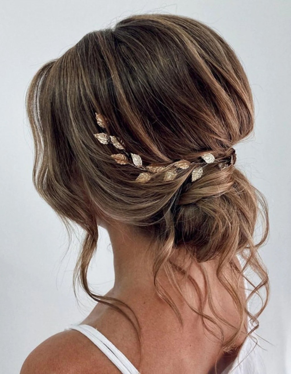 Wavy Updo With Gold Leaf Accessory Wavy Updo With Gold Leaf Accessory — Wedding Hairstyles for Medium Hair