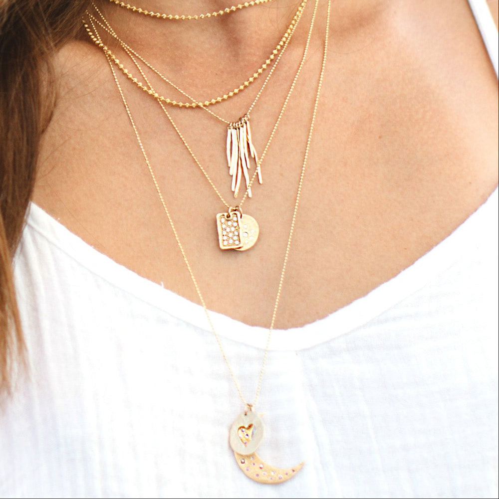 Mixed Pendants in a Layered Gold Necklace Stack — Dainty Gold Necklaces