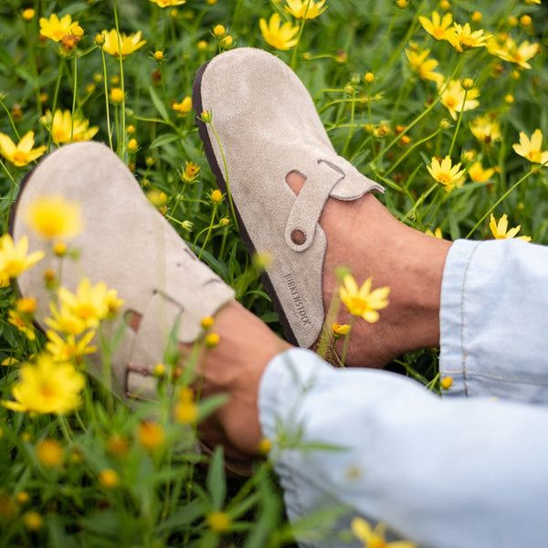 Beige Birkenstock Bostons with Light Wash Denim and Floral Backdrop Beige Birkenstock Bostons with Light Wash Denim and Floral Backdrop — Birkenstock Boston Outfits