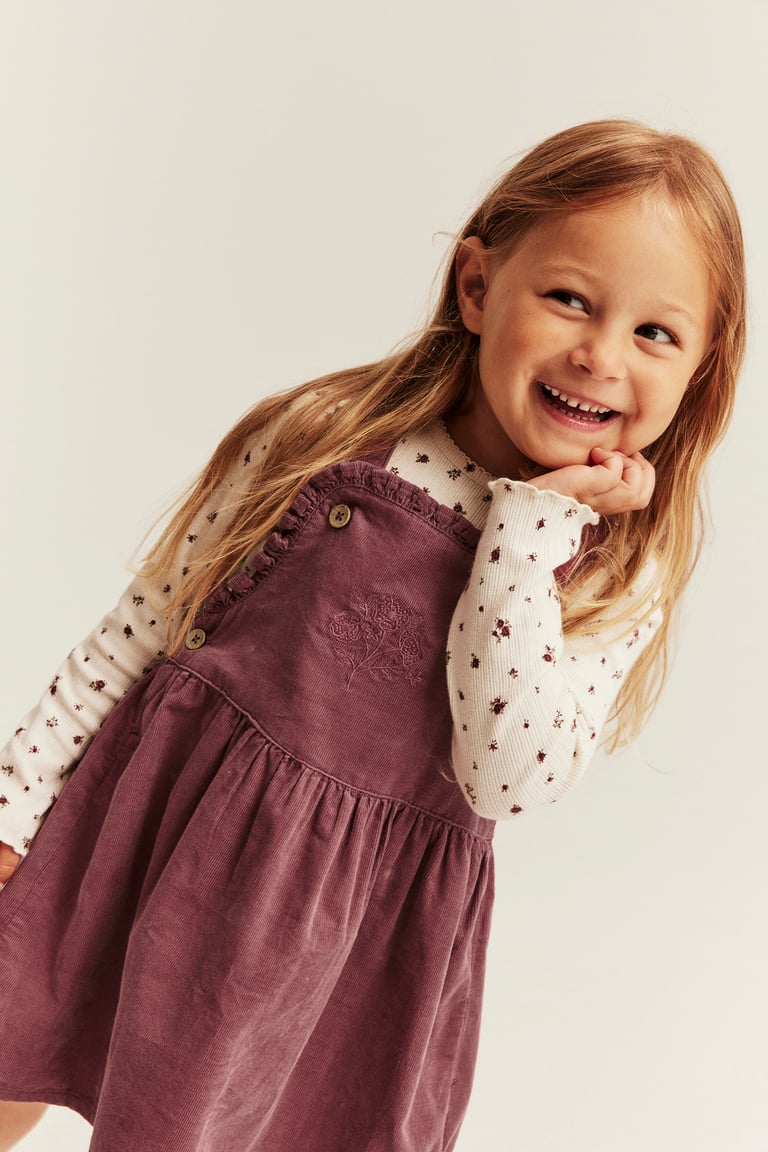 Purple Corduroy Pinafore with Floral Knit Top Purple Corduroy Pinafore with Floral Knit Top — Little Girl Outfits