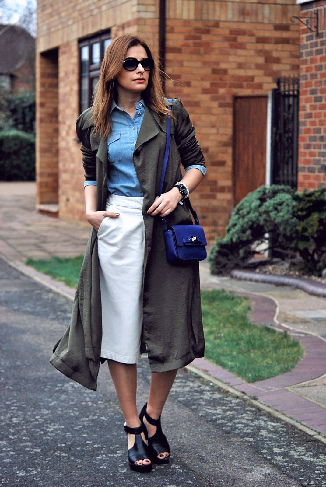 Khaki Trench Coat over Denim Shirt and White Skirt Khaki Trench Coat over Denim Shirt and White Skirt — Utilitarian Outfits