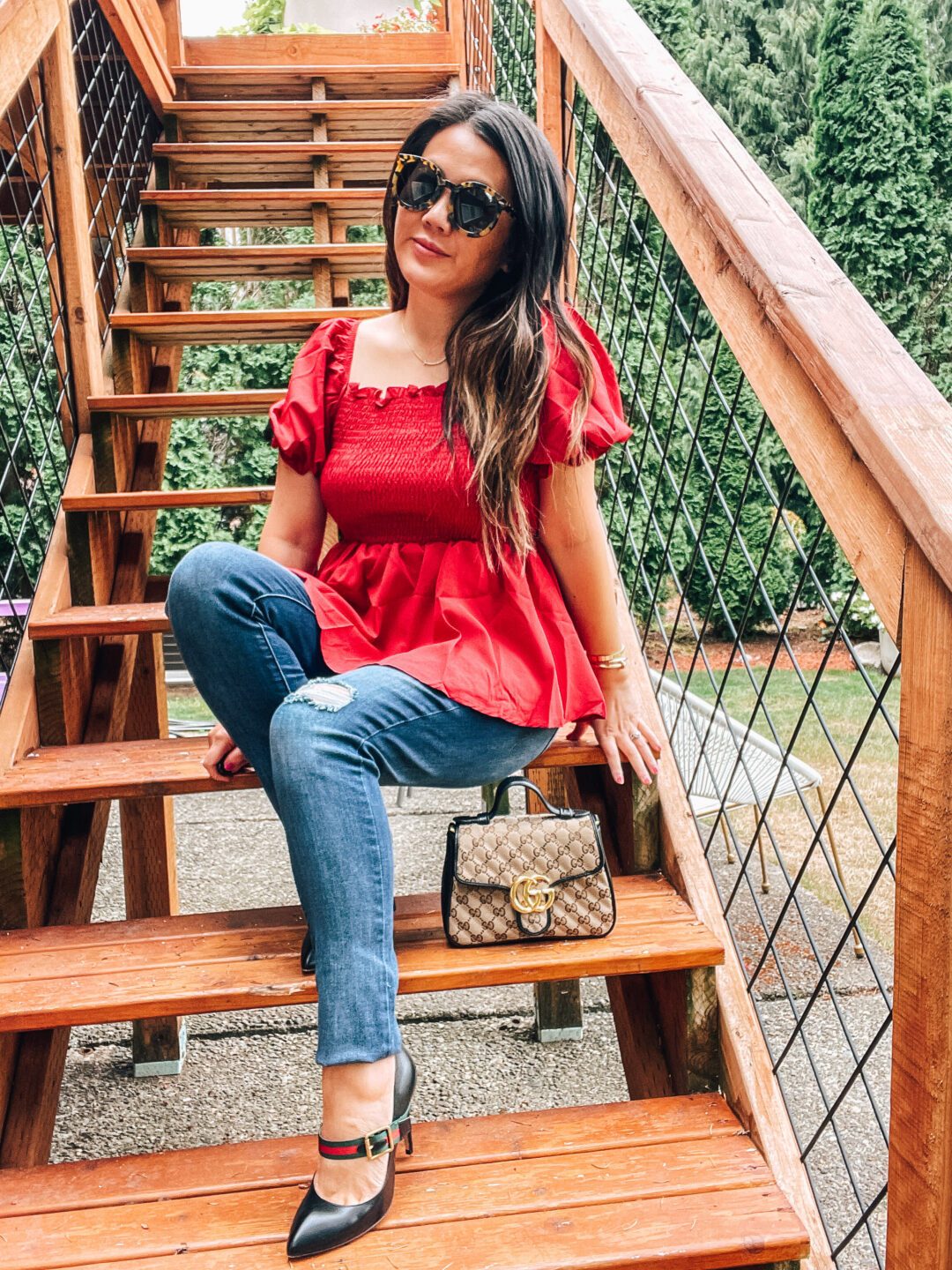 Black Pumps with Ankle Strap and Buckle Detail, Red Top and Ripped Jeans — Pumps Outfits