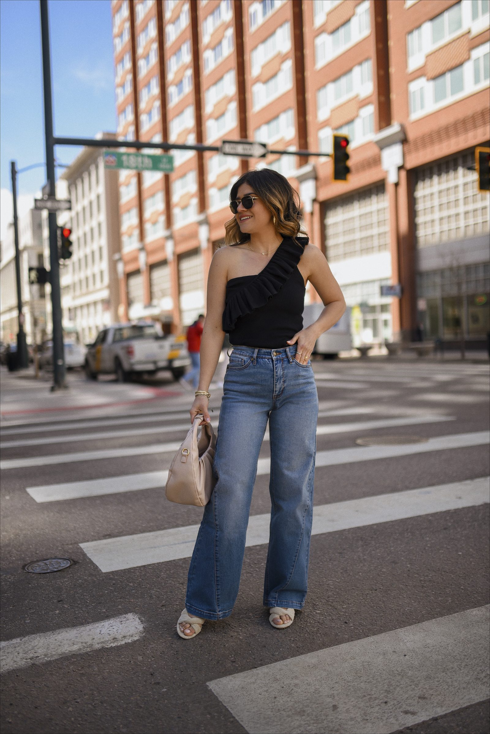 One-Shoulder Style: Ruffled Top and Slide Sandals with Medium Wash Wide Leg Jeans — Wide Leg Jeans Outfits