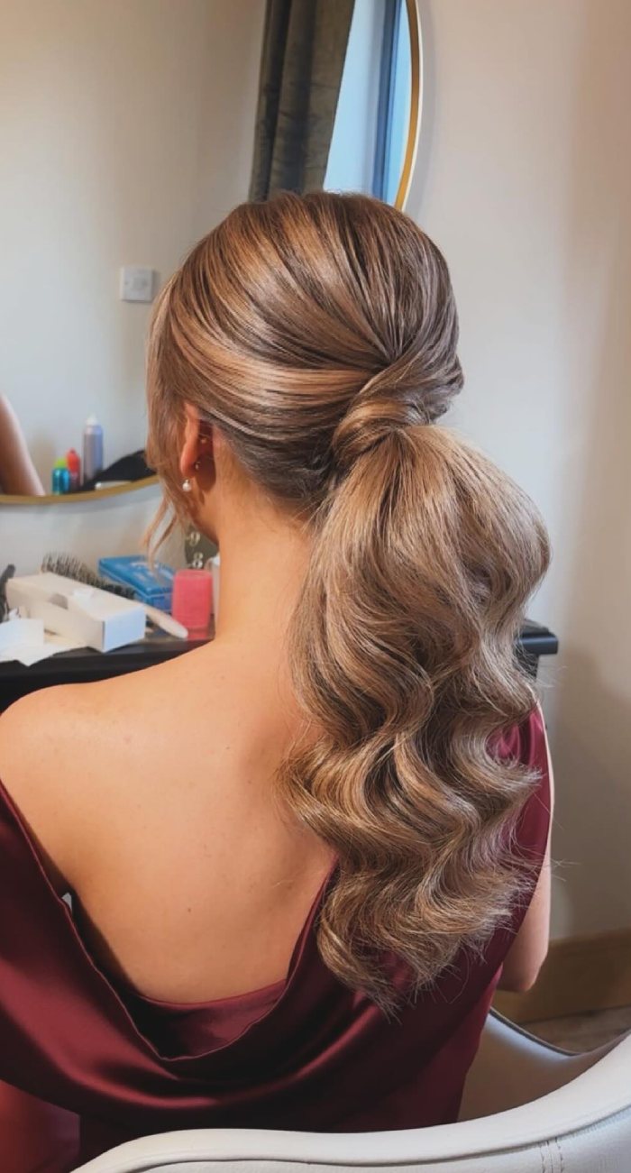 Elegant Low Ponytail with Soft Waves: Romantic Hairstyle for Weddings & Formal Events