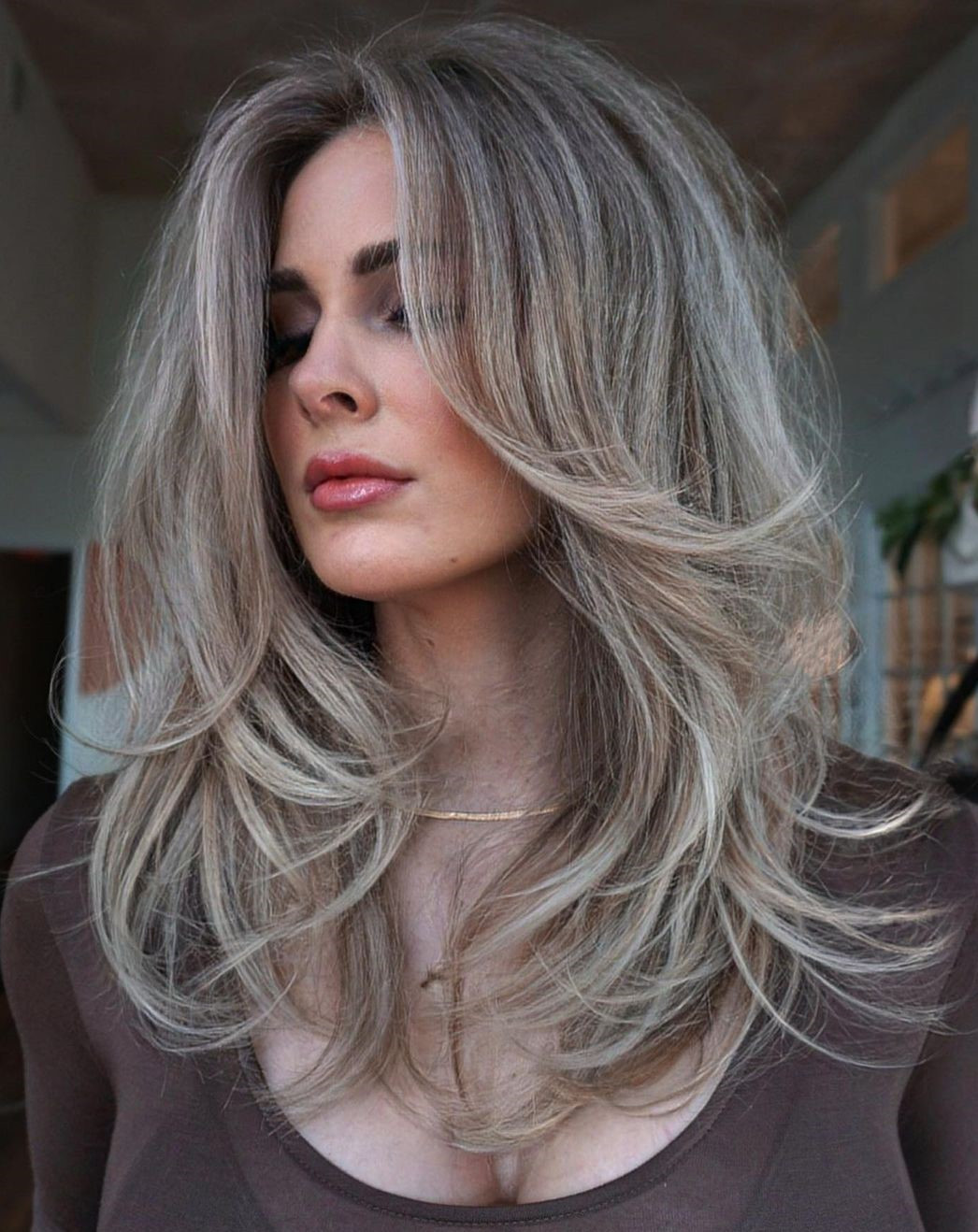 Ash Blonde With Gray Undertones and Curtain Bangs Ash Blonde With Gray Undertones and Curtain Bangs — Hair Color to Hide Gray