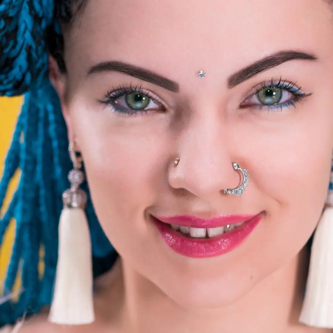 Ornate Gold Septum Ring Paired with a Subtle Nostril Stud Ornate Gold Septum Ring Paired with a Subtle Nostril Stud — Nose Piercing Ideas