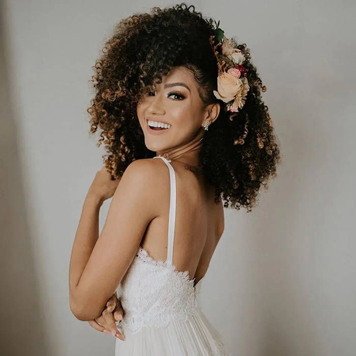 Updo With Soft Side-Swept Bangs Updo With Soft Side-Swept Bangs — Wedding Hairstyles for Curly Hair