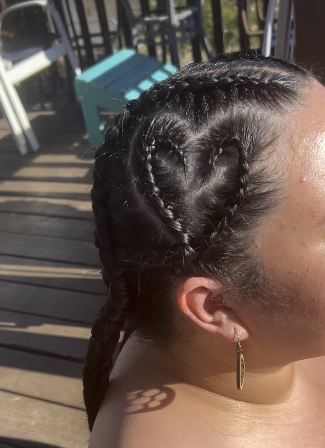Two Dutch braids with a heart.