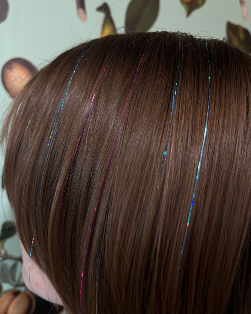 Pink Tinsel on Collarbone Blonde Hair — Hair Tinsel