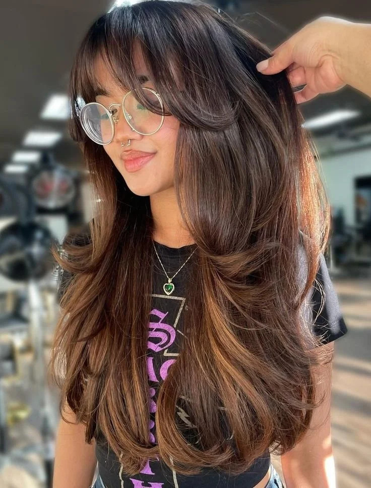 Voluminous Dark Brown Blowout With Curtain Bangs — Hairstyles for Growing Out Bangs