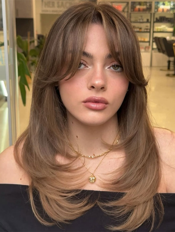 22 Flattering Thin Hair Volume Haircuts : Hazelnut Brown Butterfly Cut with Curtain Bangs