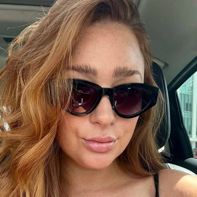 Glossy Finish: Black Cat-Eye Sunglasses with Purple Lenses — Sunglasses for Oval Face