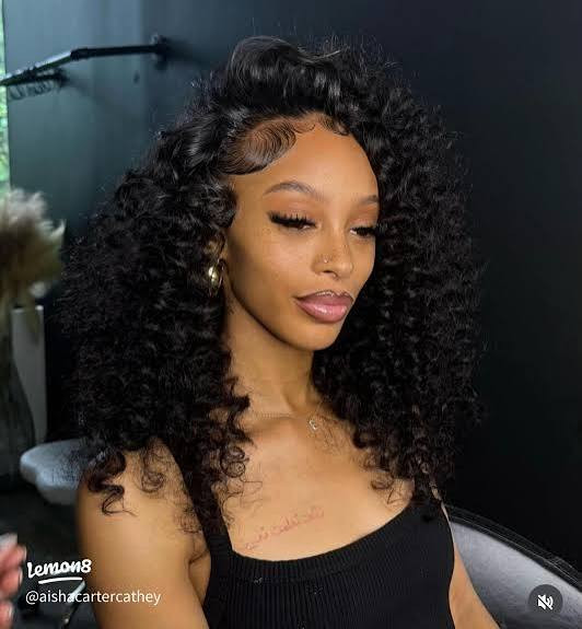 Mid-Back Black Curls with Side-Swept Bangs Mid-Back Black Curls with Side-Swept Bangs — Curly Sew In