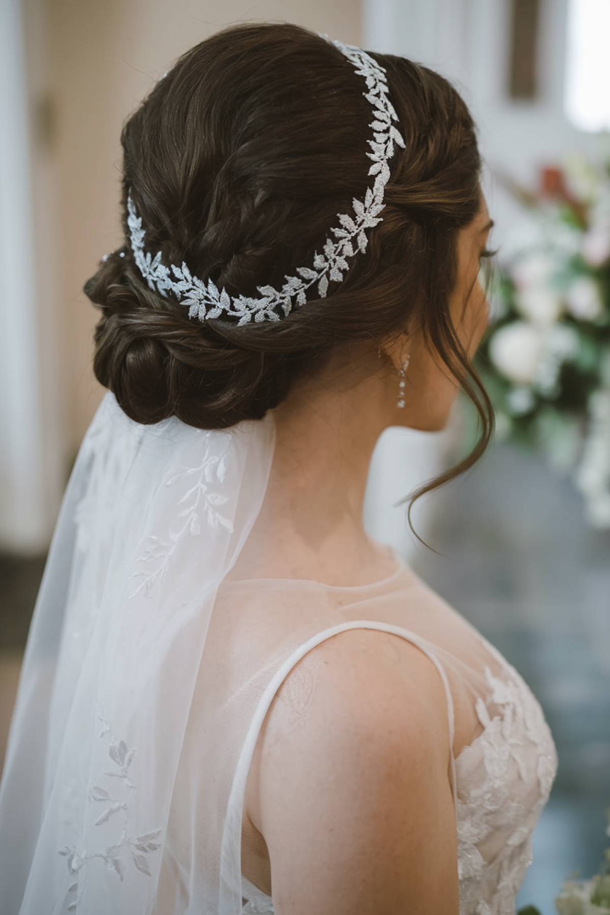 Wispy Bangs Low Braided Bun — Wedding Updos