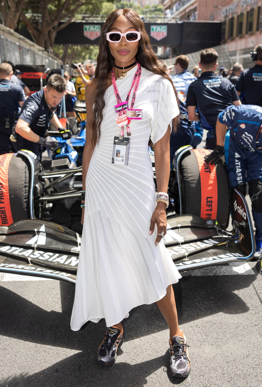 Striking White Asymmetrical Dress with Chunky Sneakers Striking White Asymmetrical Dress with Chunky Sneakers — F1 Race Outfits