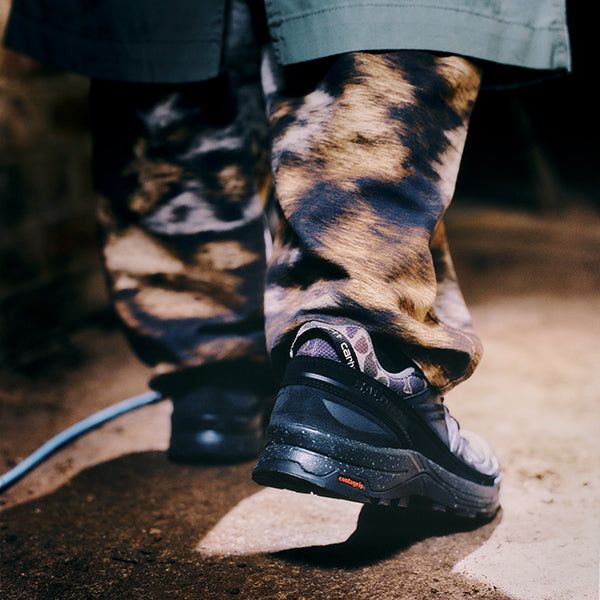 Outdoor Utility: Camouflage Trousers with Black Salomon Trail Running Shoes Outdoor Utility: Camouflage Trousers with Black Salomon Trail Running Shoes — Salomon Outfits