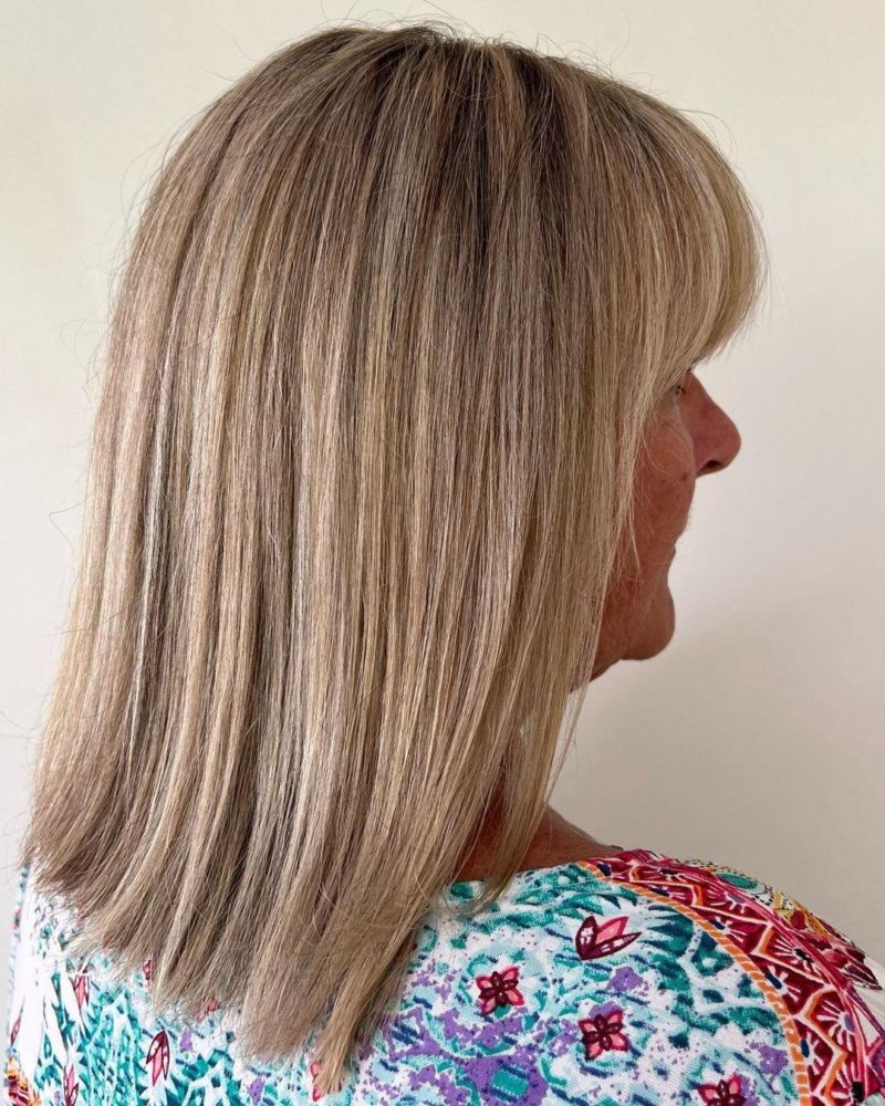 Sharp Platinum Blonde Bob with Blunt Bangs Sharp Platinum Blonde Bob with Blunt Bangs — Blonde Hair Over 50