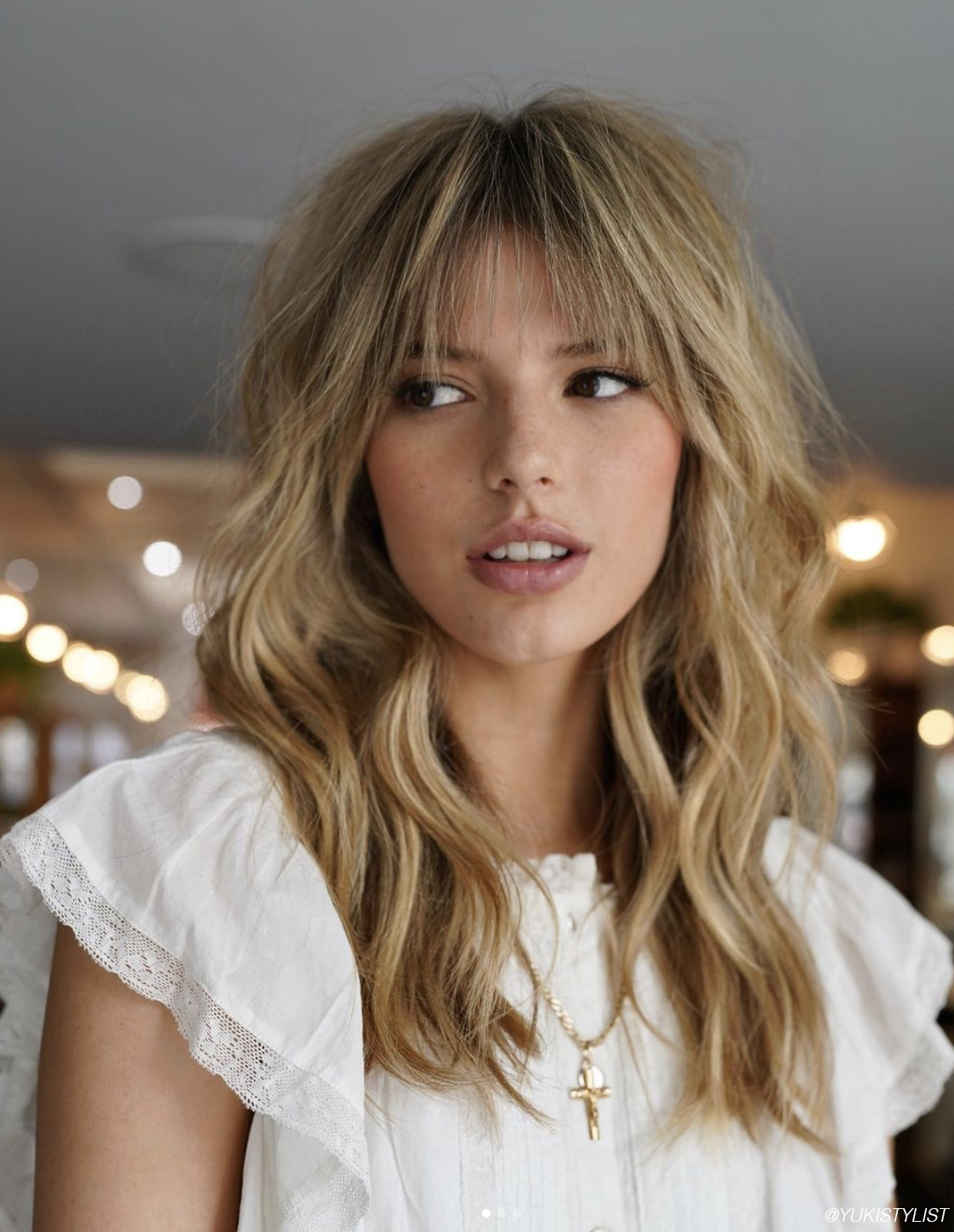 White Lace-Trim Top and Shaggy Blonde Wispy Bangs