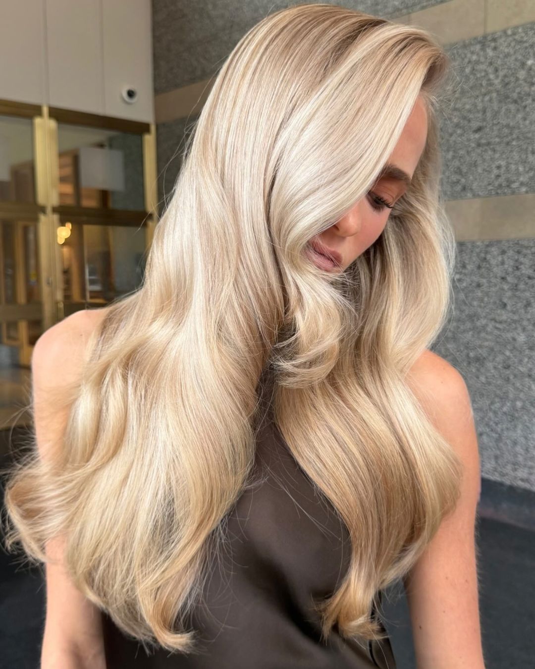 Mid-Back Ash Blonde With Curtain Bangs — Silk Press with Layers