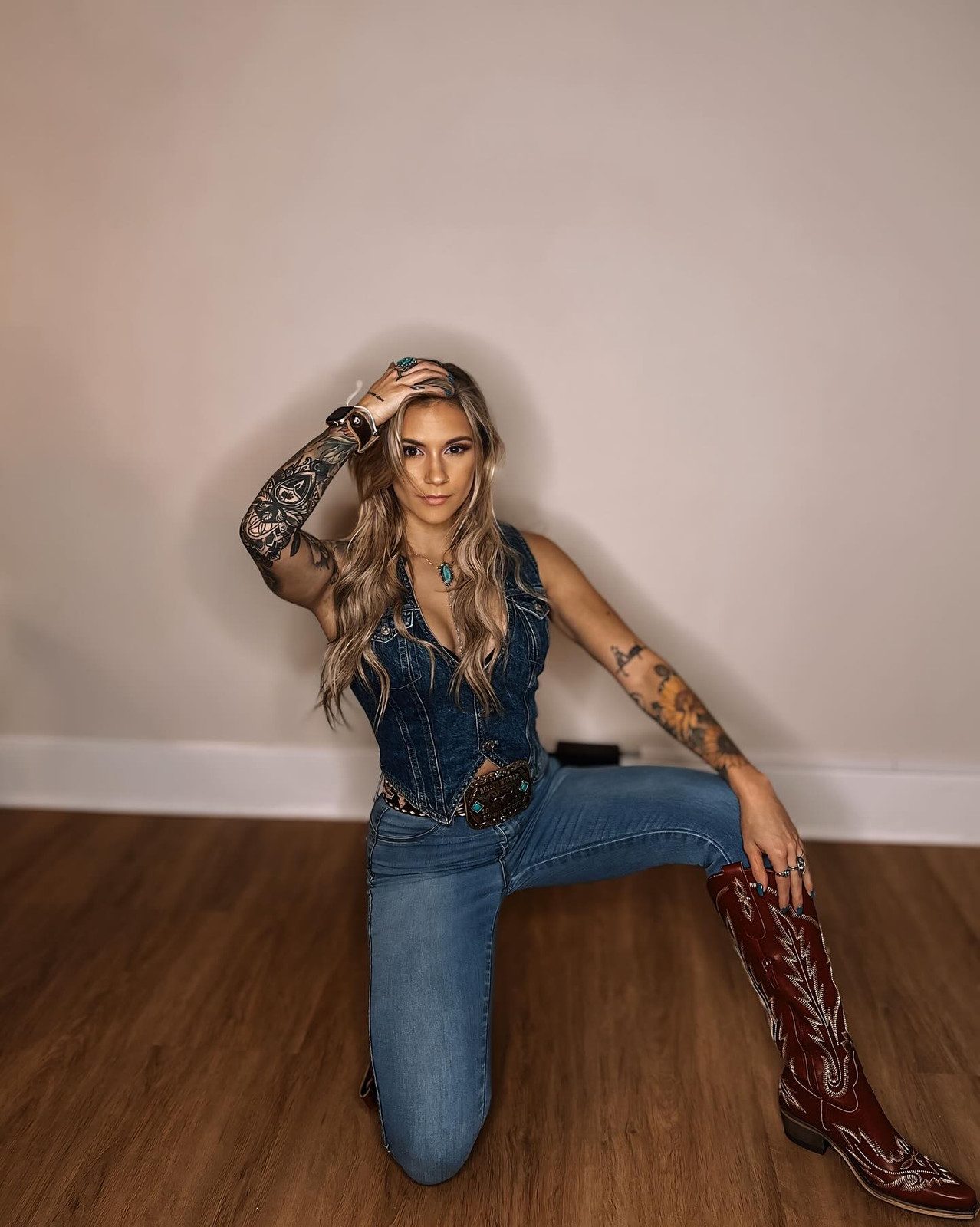 Vibrant Red Cowboy Boots Elevate a Casual Denim Look Vibrant Red Cowboy Boots Elevate a Casual Denim Look — Cowboy Boots with Jeans Outfits