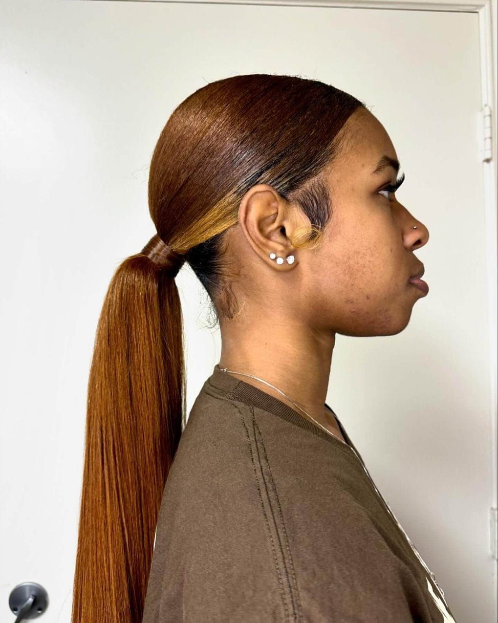 Sleek Ponytail with Side-Swept Bangs — Volleyball Hairstyles