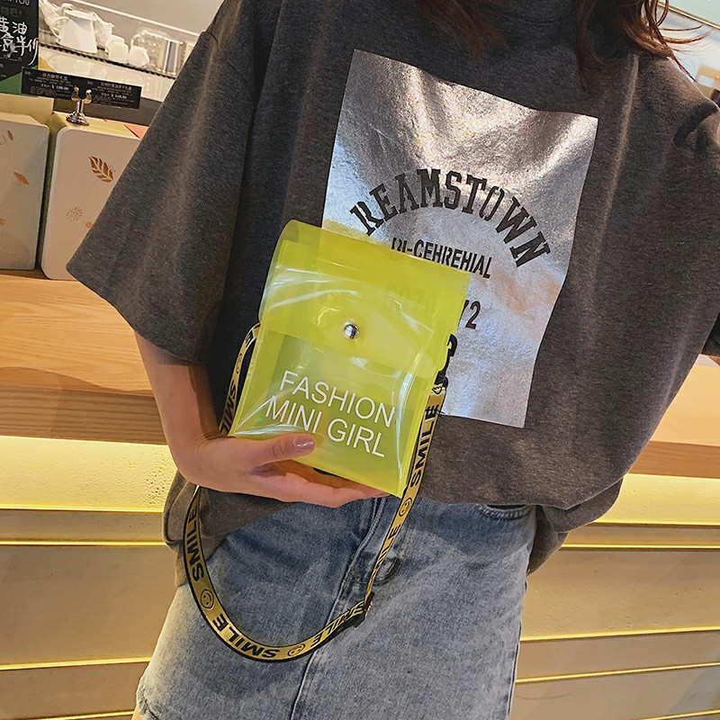 Graphic Statement: Yellow PVC Bag with Casual Denim — Clear Bag Outfits