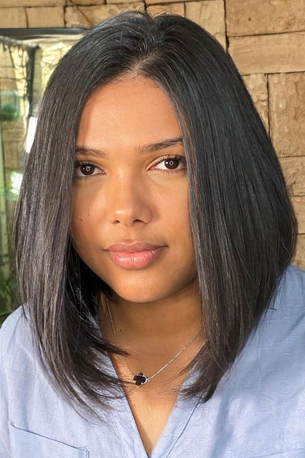 Feathered Lob With Sleek Middle Part — Haircuts for Chubby Faces
