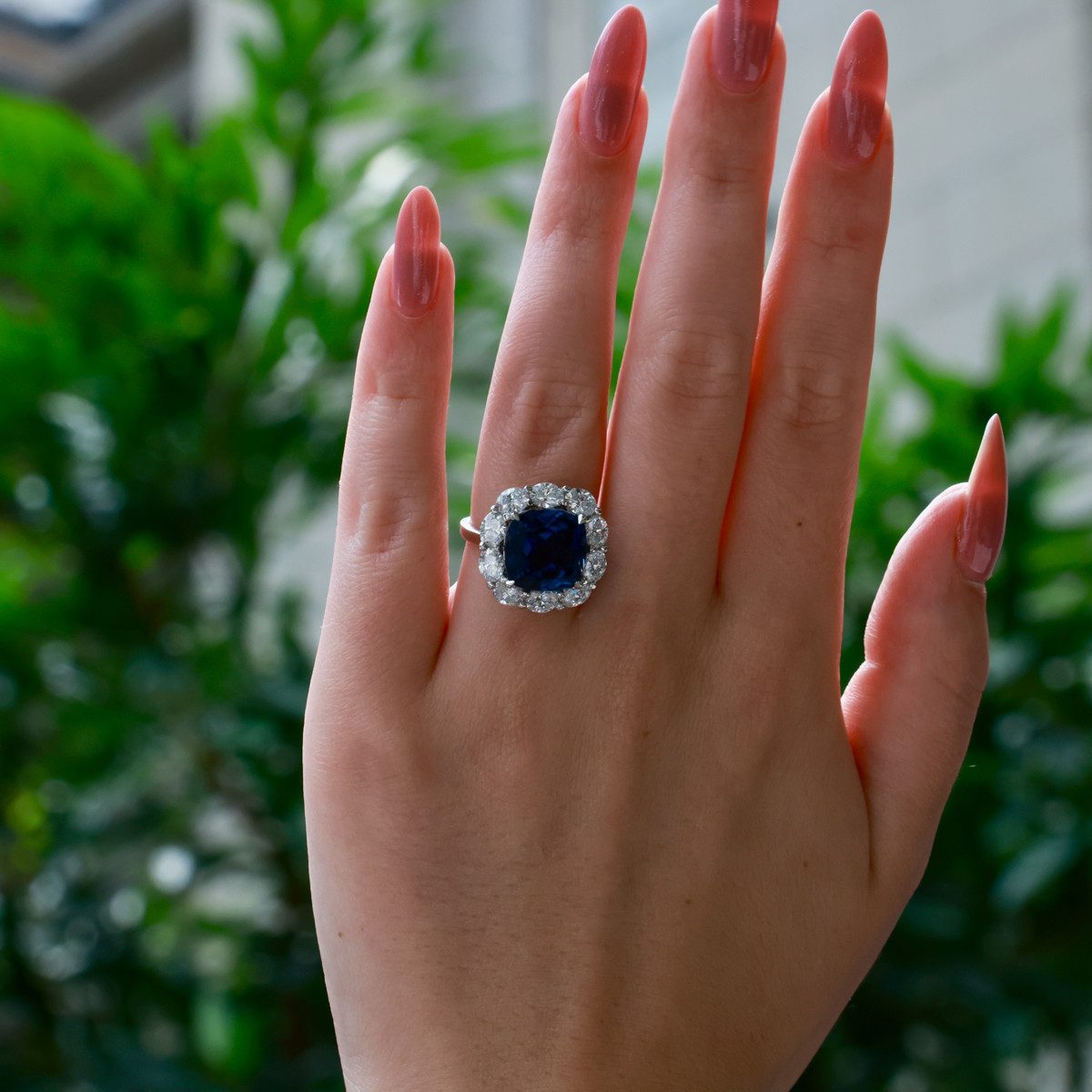 Sapphire and Diamond Ring with Red-Tipped Manicure — Cocktail Rings
