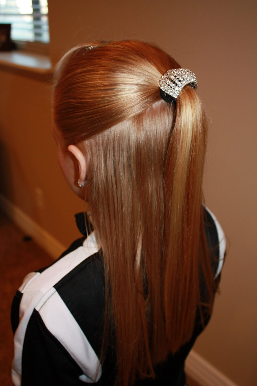 Sleek High Ponytail With Sparkling Accessory Sleek High Ponytail With Sparkling Accessory — Dance Competition Hairstyles