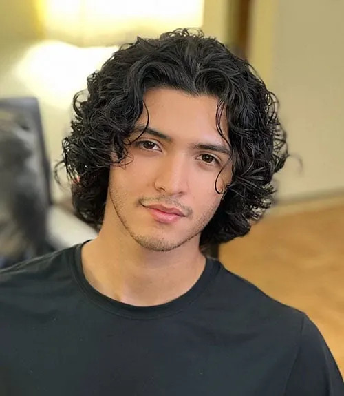 Curly Collarbone With Curtain Bangs — Long Hairstyles for Men