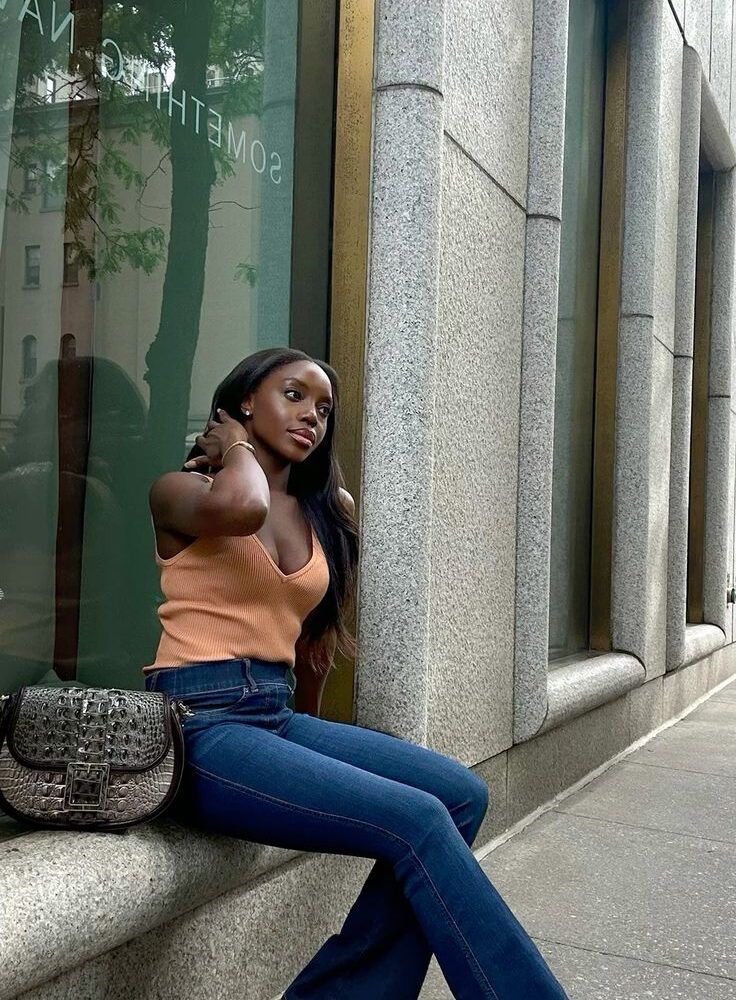 Bold Contrast: Dark Wash Bootcut Jeans with Orange Tank Top and Heels Bold Contrast: Dark Wash Bootcut Jeans with Orange Tank Top and Heels — Bootcut Jeans Outfits