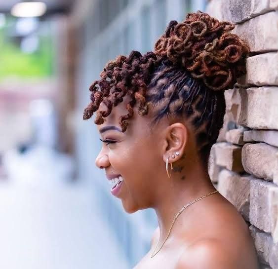Brown Loc Updo with Blonde Highlights and Tendrils — Loc Bun