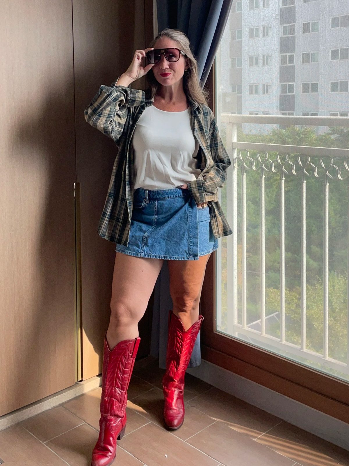 Festival Ready: Red Cowboy Boots with Denim Mini and Plaid — Cowboy Boots with Skirt Outfits