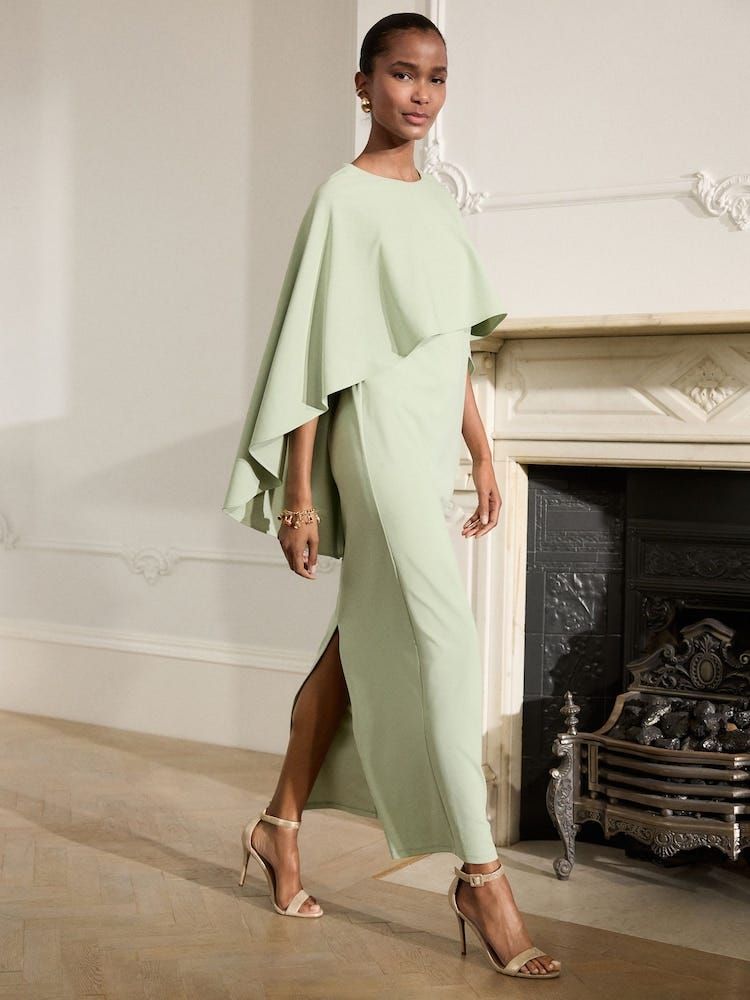 Elegant Pale Green Column Dress with Dramatic Cape Overlay Elegant Pale Green Column Dress with Dramatic Cape Overlay — Mother of the Bride Outfits