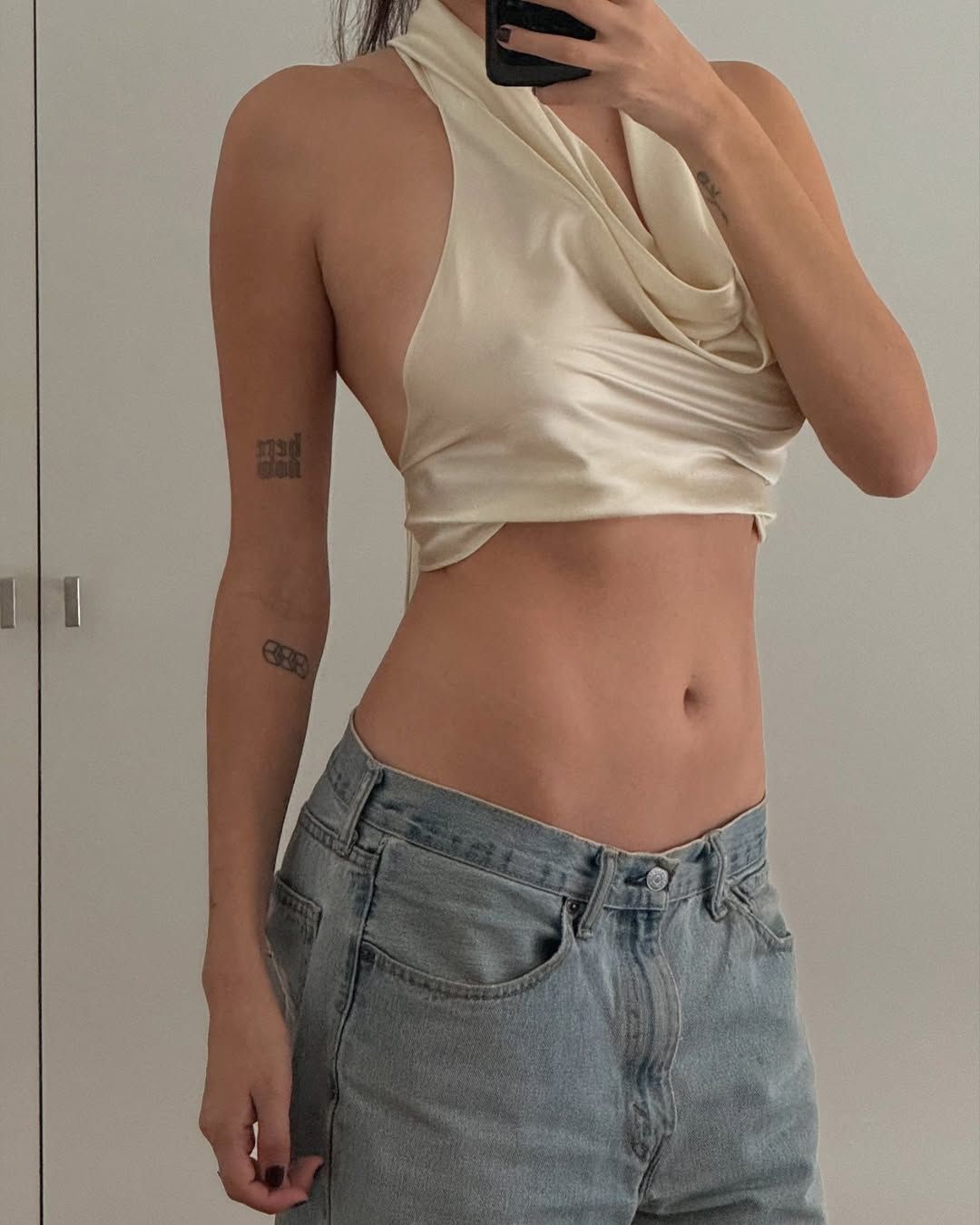 Luxurious Ivory Satin Cowl Neck Halter Top with Light-Wash Jeans Luxurious Ivory Satin Cowl Neck Halter Top with Light-Wash Jeans — Halter Top Outfits