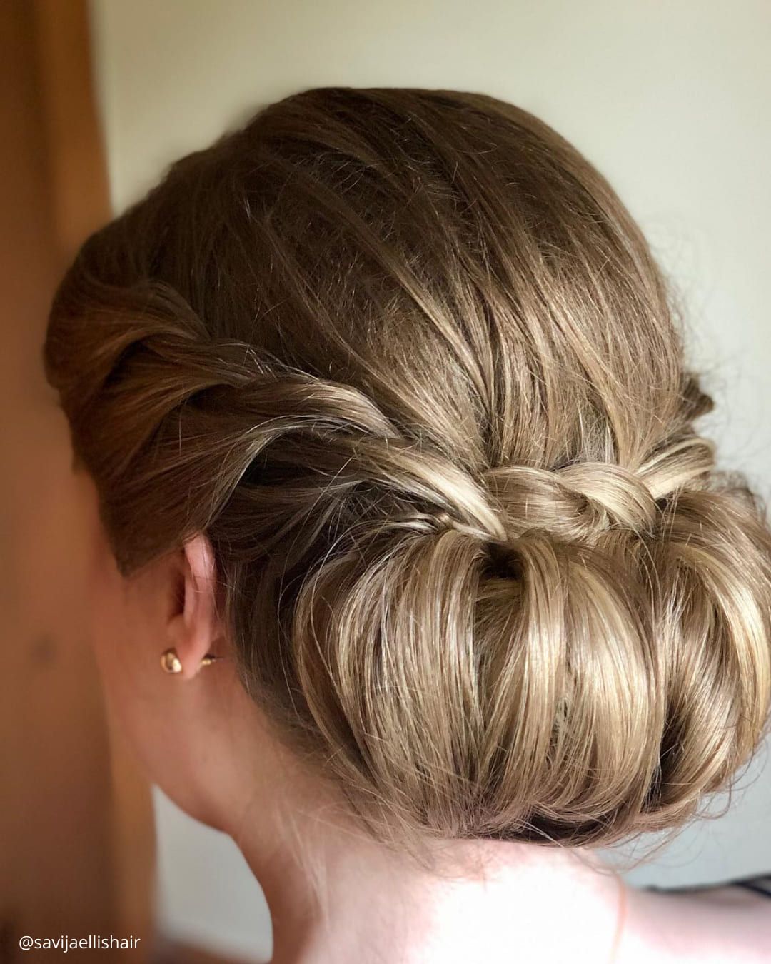 Ash Blonde Low Bun with Braided Accents — Mother of the Groom Hairstyles