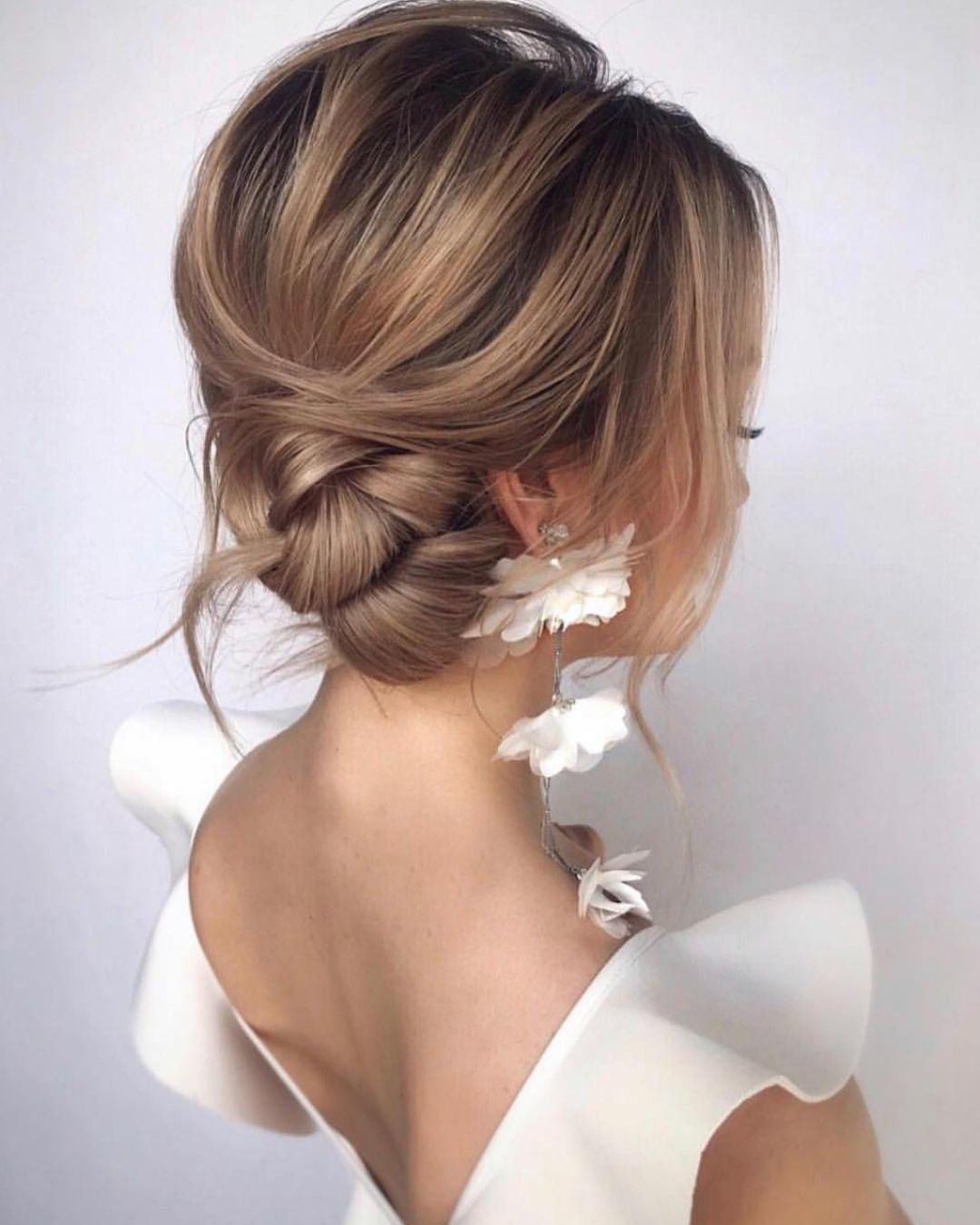 Sleek Ash Blonde Chignon with Wispy Bangs — Church Hairstyles